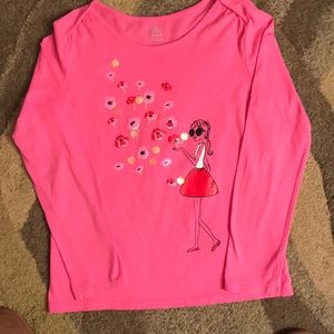 A long sleeve top with a cute design